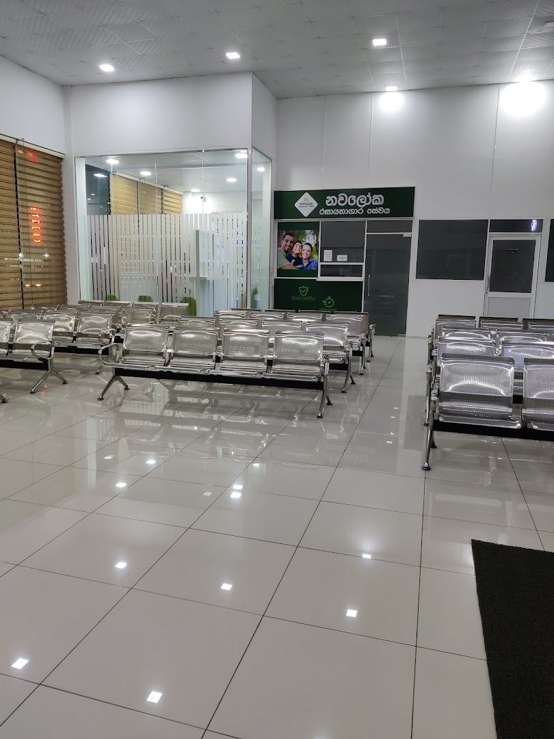Bright waiting area with rows of metal seating at Seeduwa Hospitals